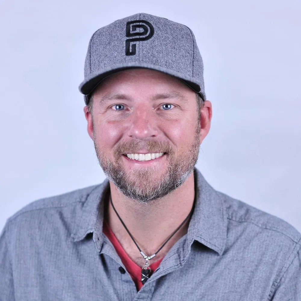 Steve Polacek in a gray cap, smiling
